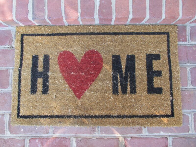 Welcome Mat reading "Home" with a heart instead of an "o"